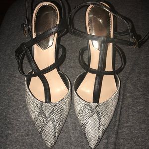 Black and snakeskin strappy pumps